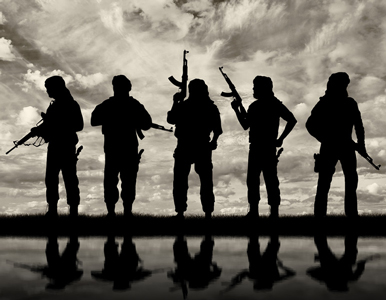 five terrorists silhouetted against a cloudy sky