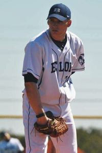 Justin Vetterl in baseball uniform with baseball glove