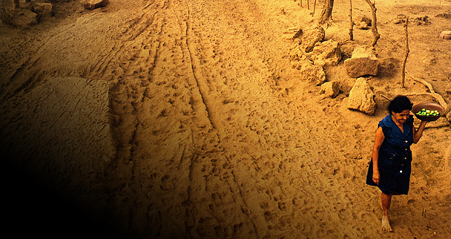 Nicaraguan woman walking on a dusty road