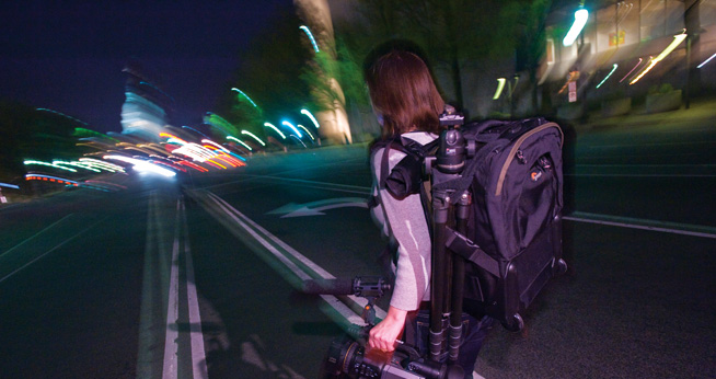 Announcing the Me in D.C. photo contest. School of Communication student walks toward the Capitol.