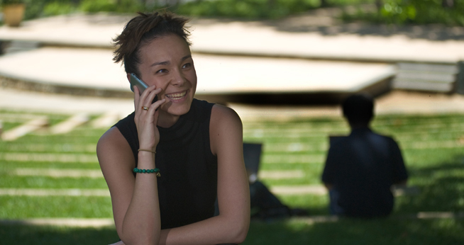 Staff Member Using Cell Phone in Amphitheatre