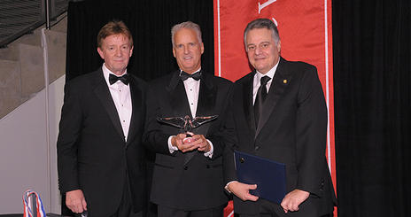 President Neil Kerwin, SPA/BA '71 (left) and Board of Trustees chair Gary Abramson, SPA/BA '68 (right), presented Jack Cassell, SOC/BA '77, the 2009 President’s Award.