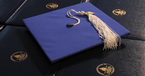 Photo: Mortarboard and diplomas