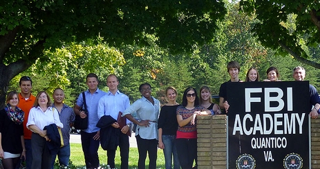 Students stand in front of the FBI Academy in Quantico, VA.