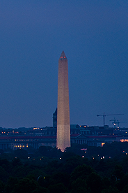 Photo of the Washington Monument and the Washington, DC skyline at night.