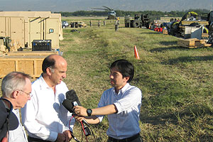 Ambassador to Haiti Kenneth Merten talks with reporters after the earthquake.