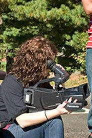 Discover the World of Communication student works on camera technique.
