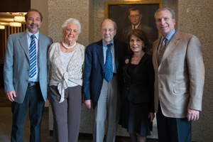 The late Jack Kay (center) stands with family in front of his father’s portrait at the Abraham S. Kay Spiritual Life Center’s rededication in fall 2012.