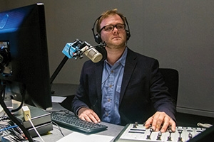 WAMU's Patrick Madden broadcasting from his desk