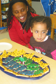 CDC student and adult with birthday cookies