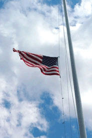 Flag flies at half-mast over Arlington National Cemetery, photo by Alyssa Wolice