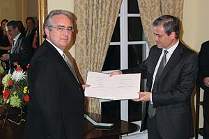 Jack Rasmussen, left, receives the Knight’s Cross of the Order of Merit from the ambassador of Hungary, Bela Szombati.