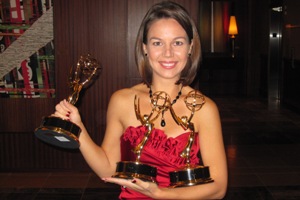 Janet Rodriguez holds her 3 Emmy Awards