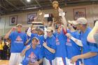 Men's Baskebtall Team with Trophy.