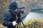 Filming on location in a nature setting.