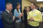Photo: Eli Futerman, left, speaks with Blaze Cambruzzi, right, and other Kogod students.