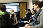 Kogod students listen during the presentation at the Bethesda headquarters of Calvert Investments.