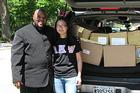 Kogod Student donating used Career Development textbooks to Marshall Heights Community Development Organization