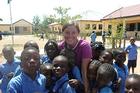 SETH student Jessica Guttenberg visits the Remi Educational Foundation, a school for special needs children. The students were taking a lunch break and playing in a courtyard. (Photo: Bill Churma)