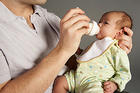 Baby drinking a bottle.