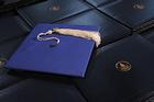 mortarboard and diplomas