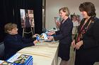 Nancy Clarke signs copies of her book, My First Ladies, for Ann Kerwin and Anita McBride and other Friends of the Arboretum at the fourth annual arboretum lunch. (photo: Jeff Watts)