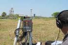 Professor Greg Smith setting up a recorder a quarter mile from the launch pad. Photo courtesy of Greg Smith.