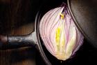 Purple onion in a cast iron skillet