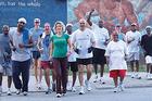 Photo: Back on My Feet founder Anne Mahlum with members of the organization.