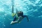 High school student filming underwater