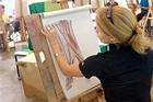 AU art dept student painting in class