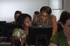 OIT Trainer Assisting a Student