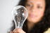 Lady holding lightbulb