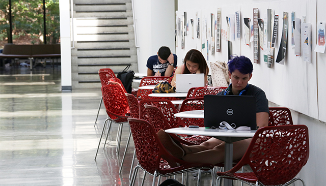 Students Studying at desks in hallway of Katzen
