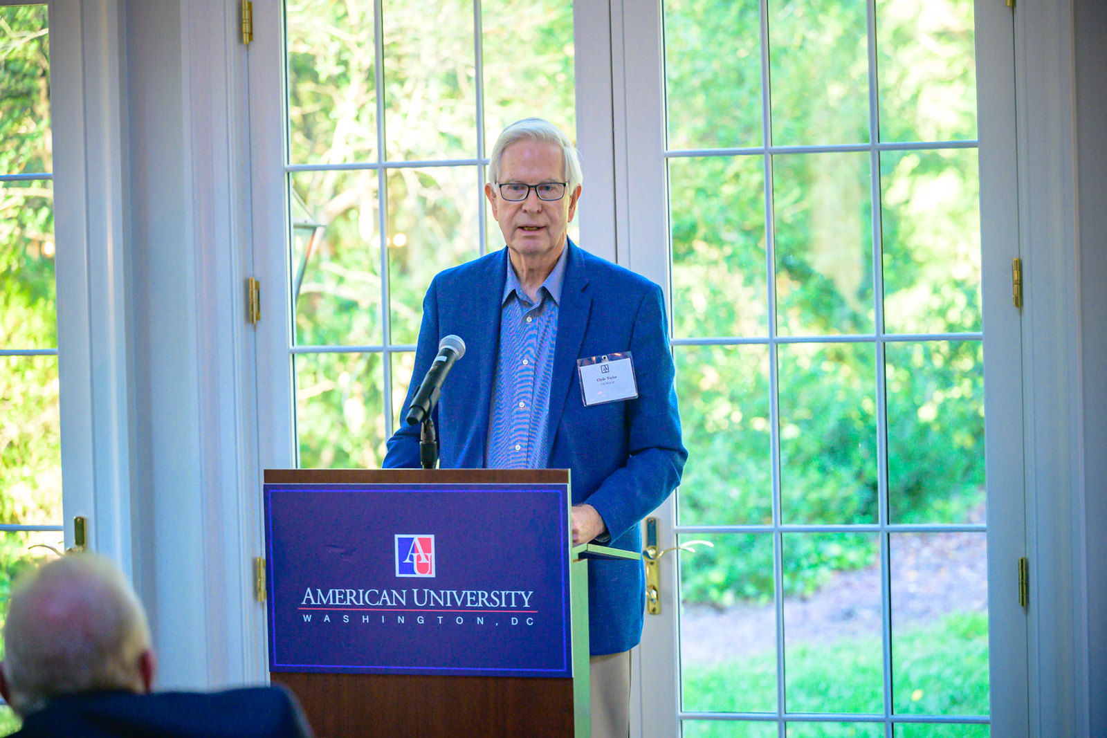 Ambassador Clyde Taylor speaks from the podium.