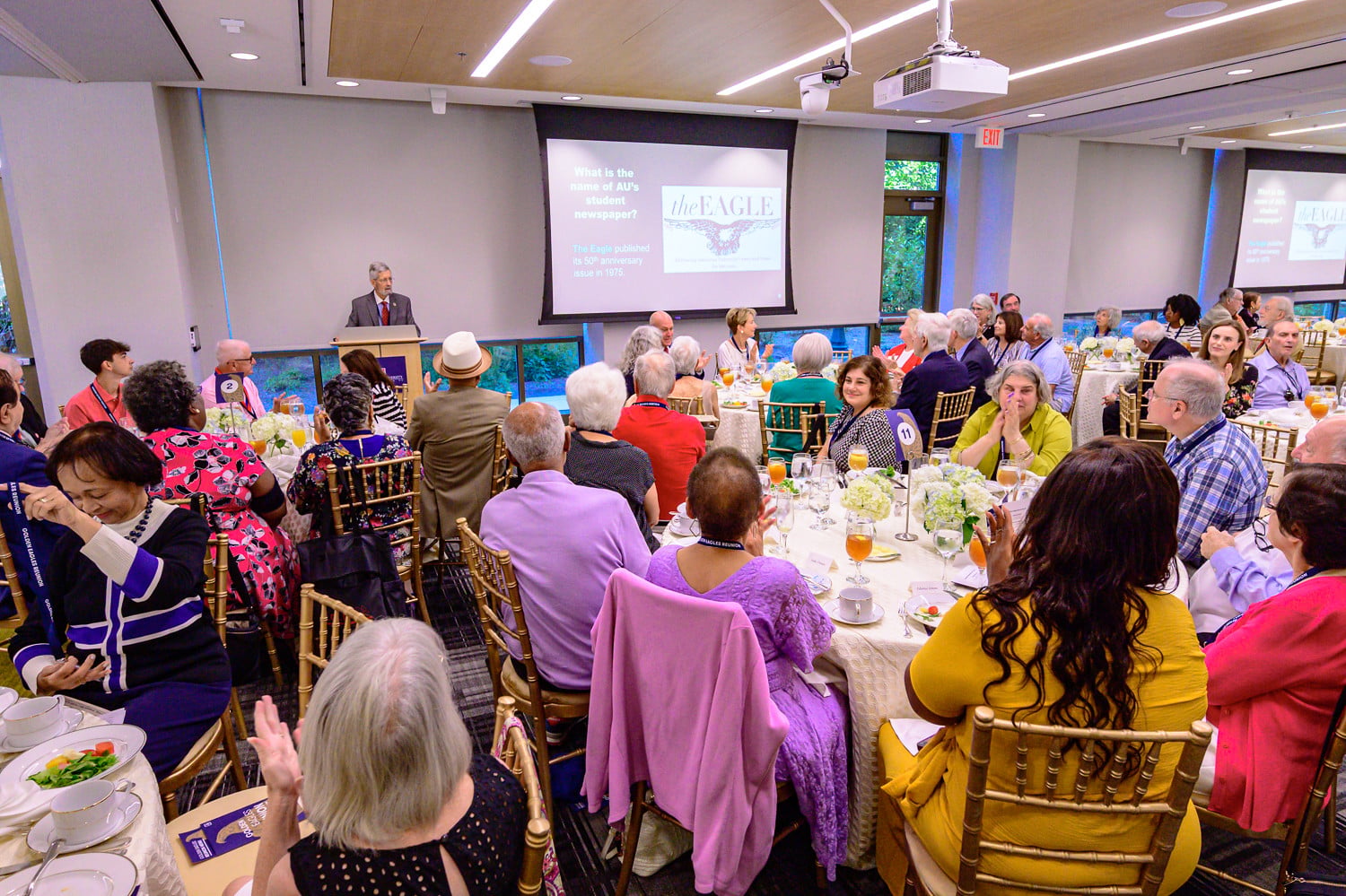Professor Kent Baker addressing an audience.