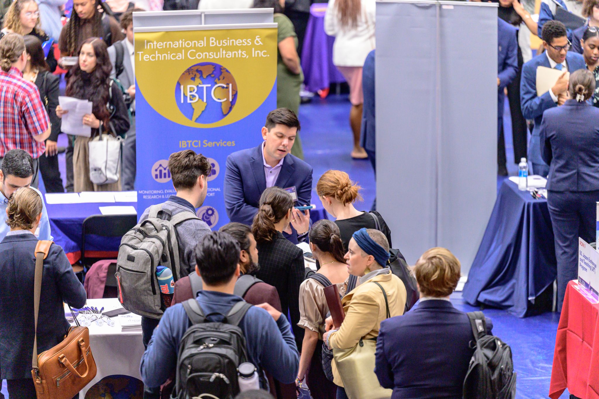 Alumni and students at a job fair.