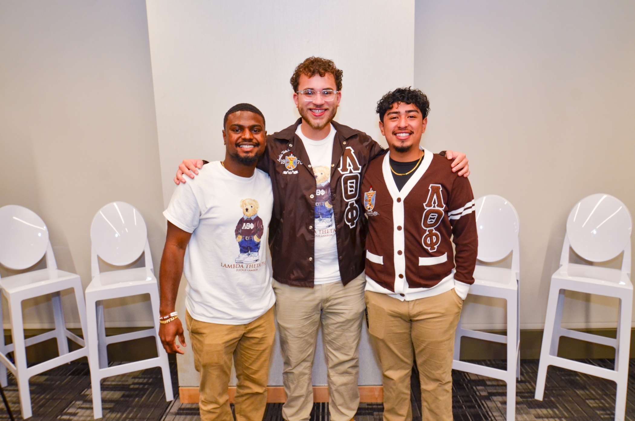 Three alumni at an event.