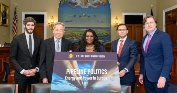 Danica Starks poses at a 2019 conference with other members of the Helsinki Commission.