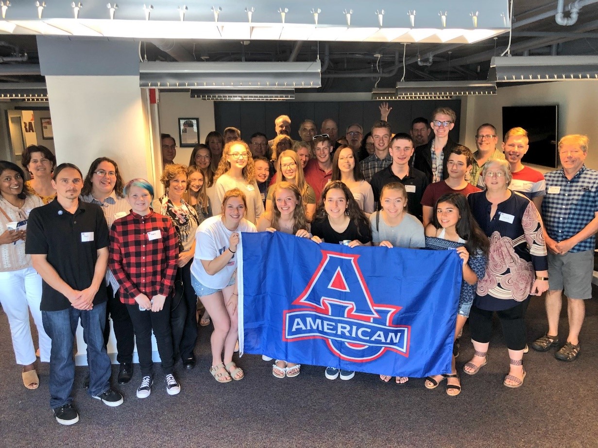 Class of 2022 holding a blue AU banner
