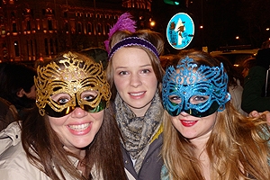 Three students in carnival colorful masks