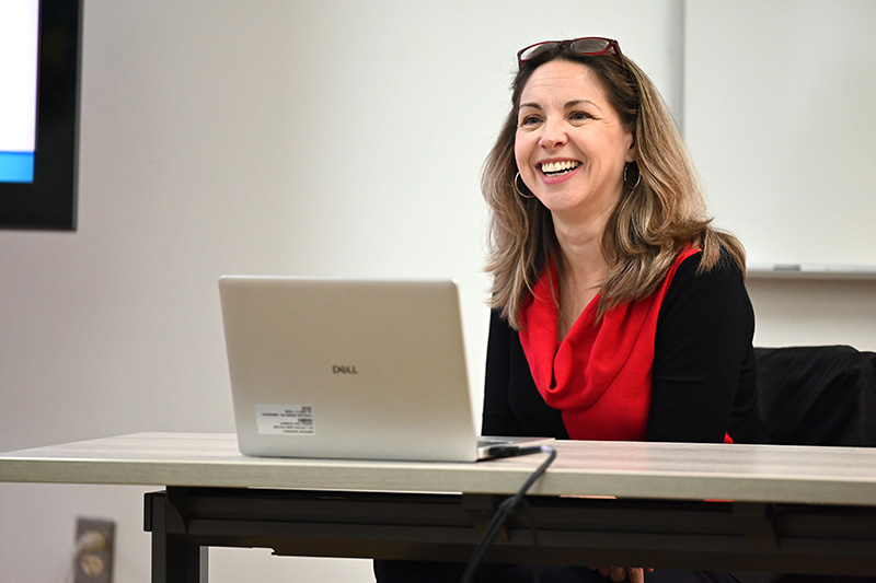 Dr. Jennifer Steele presents to an in-person and online group of faculty members.