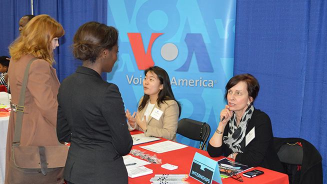 Employer talking with students