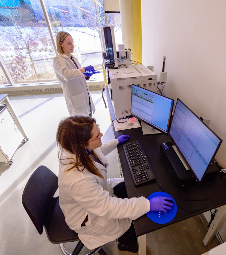 Professor Koch and student assistant in the Environmental Science Lab.