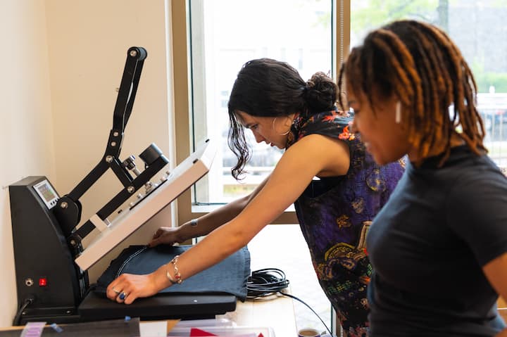 Students working the Heat Press.