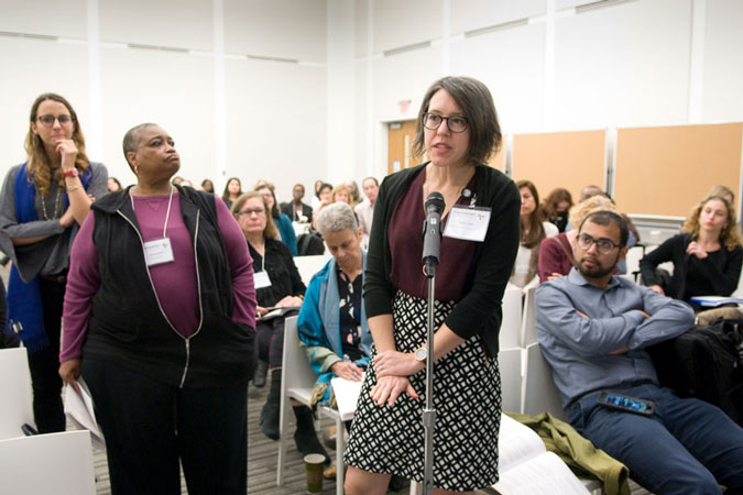 Woman speaking into a microphone