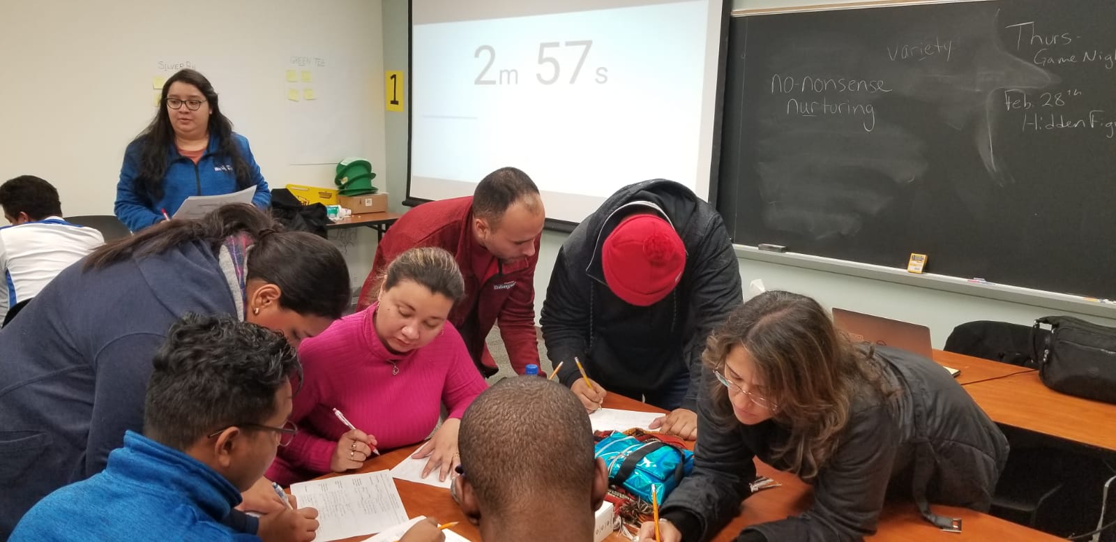 A group of people in a classroom collaborating