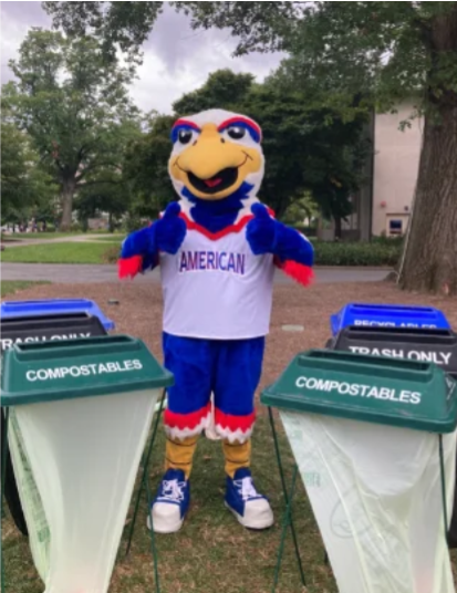 Clawed Z. Eagle with trash and recycling containers
