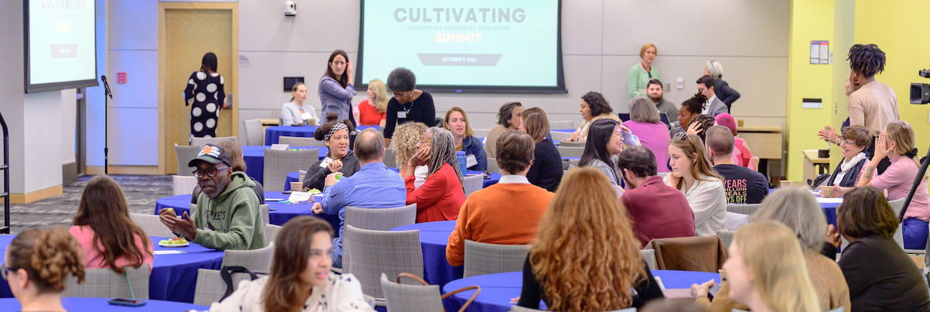 Health Schools Summit groups at tables.