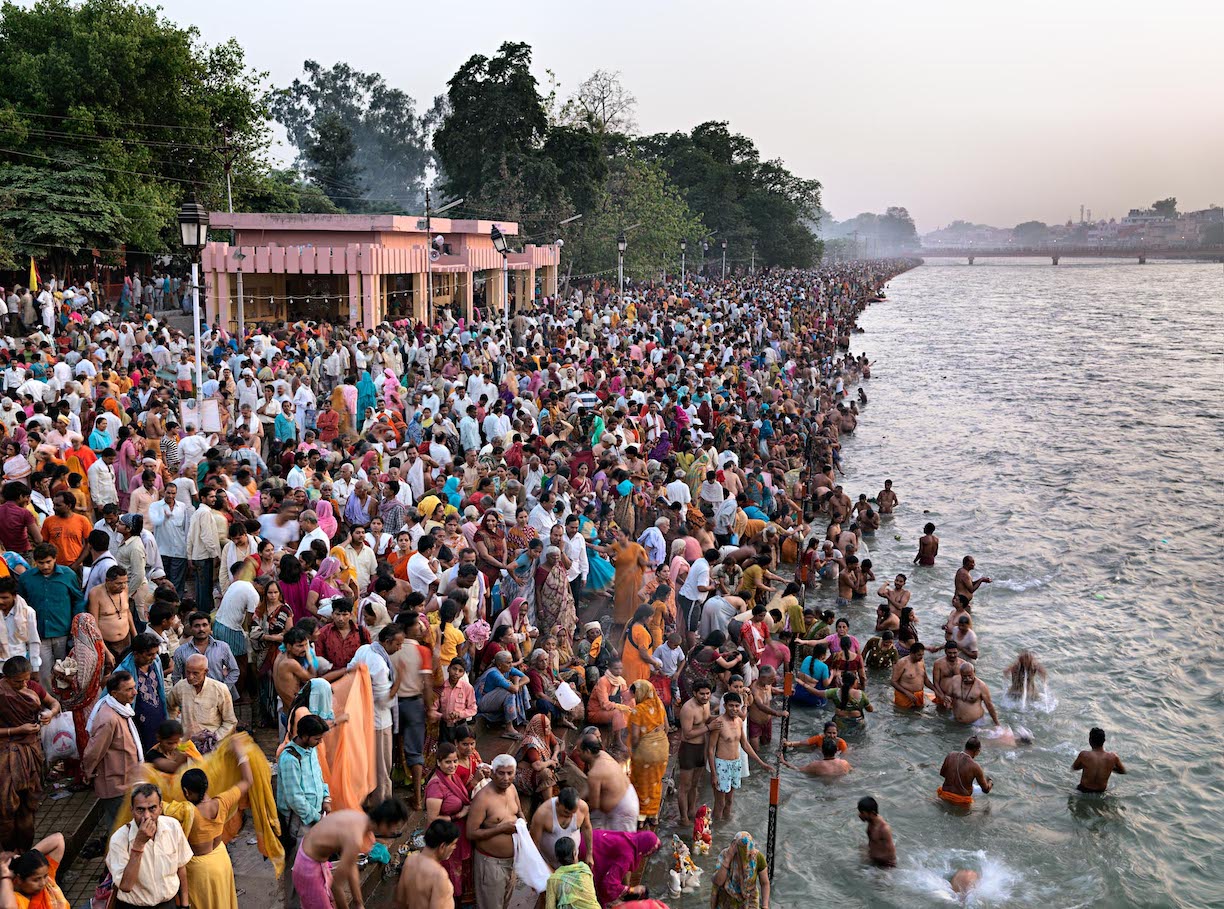 Crowd of people by riverside